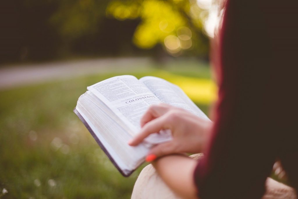 Woman studying Scripture to find First Love
